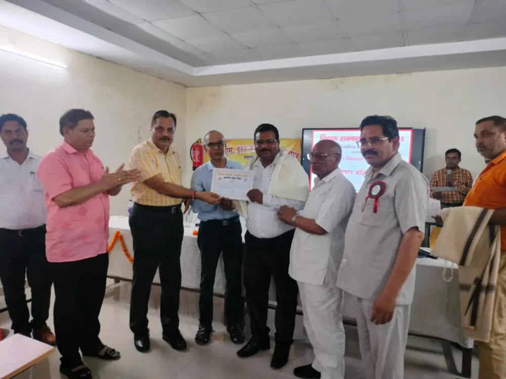 Principal of A.H.P. Inter College receiving an award